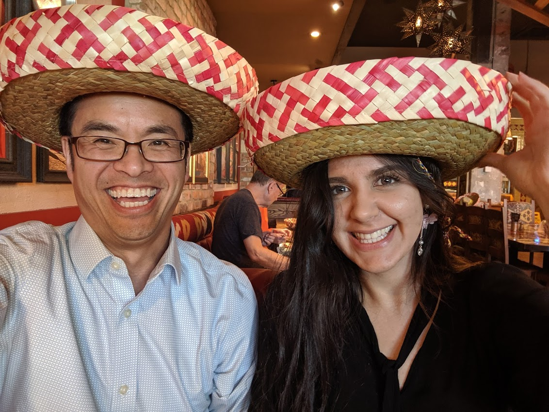 Professor Tung wearing Sombrero with a team member