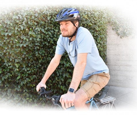 Eric Migicovsky riding a bike wearing Pebble Time Smart Watch