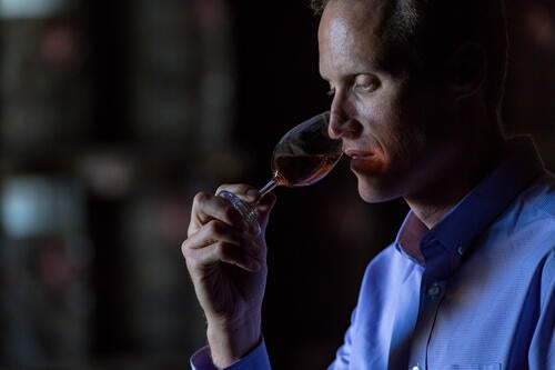 Master blender Don Livermore holds a small glass of whisky to his nose