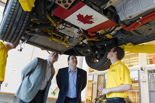 Vice President Ken Kelzer and Executive Director Brandon Vivian examine vehicle modifications