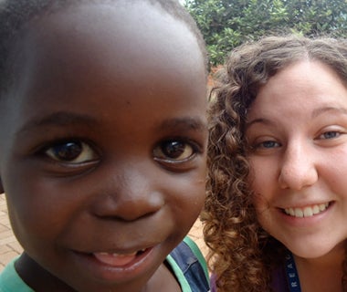Jenna Bott with a child in Uganda