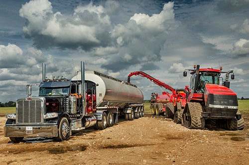 trucks transfering fertilizer
