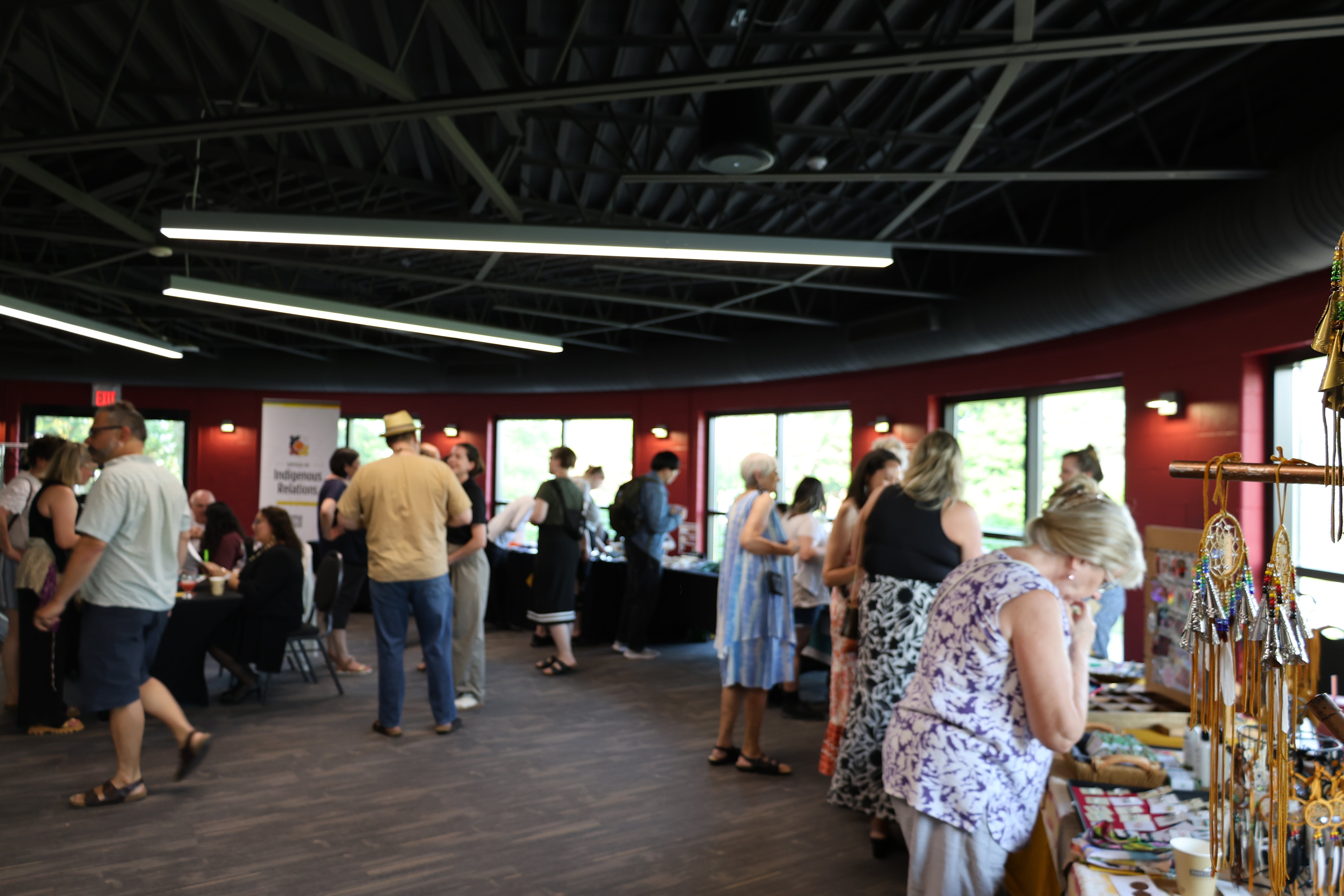 Waterloo community members visiting the local Indigenous vendor booths during intermission