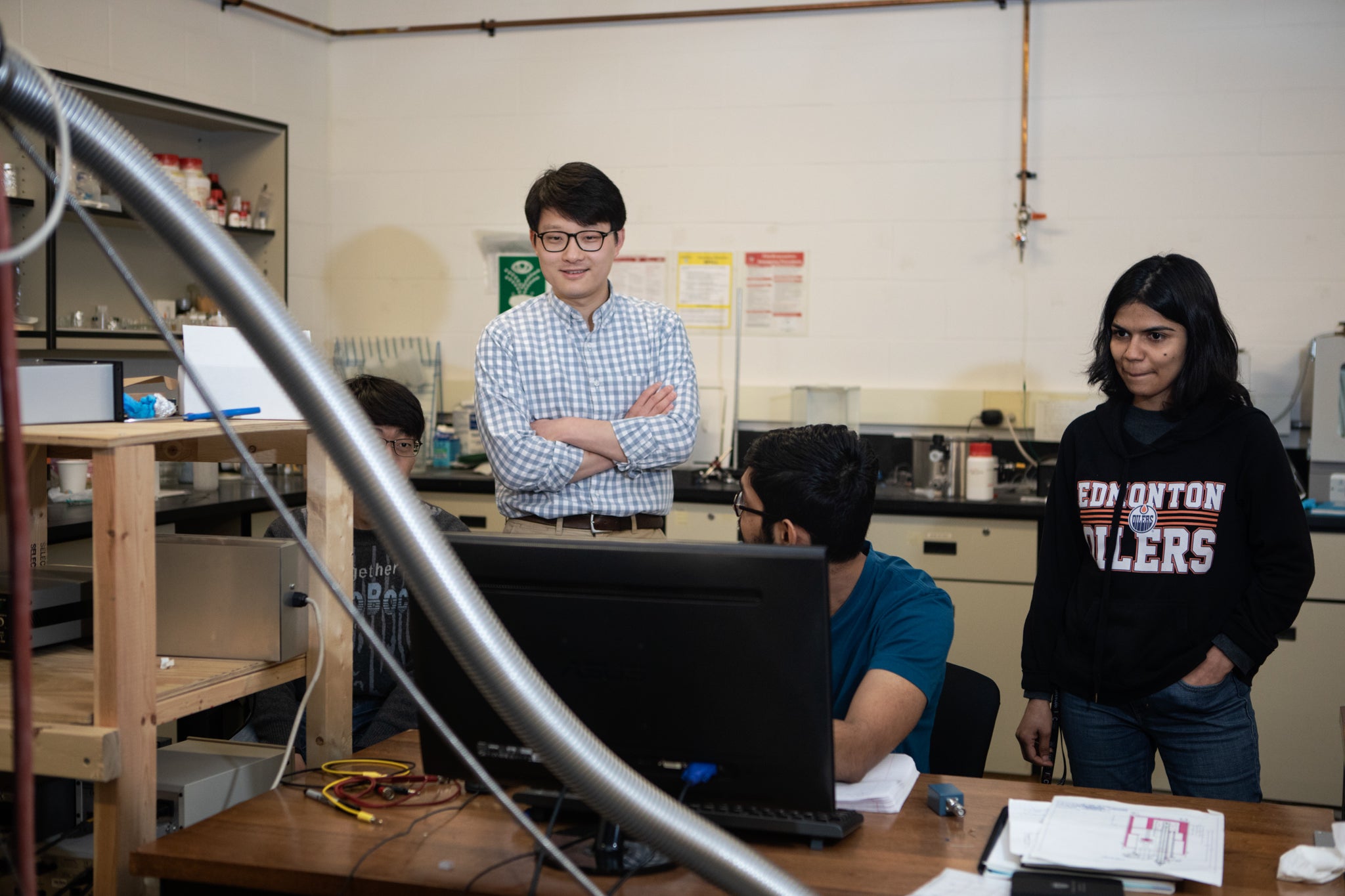 Dr. Adam Wei Tsen supervising his students