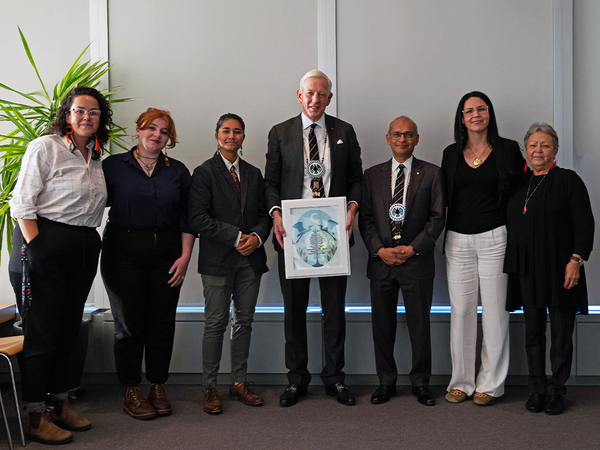 Dominic Barton receives a gift from Indigenous students and community members at Waterloo