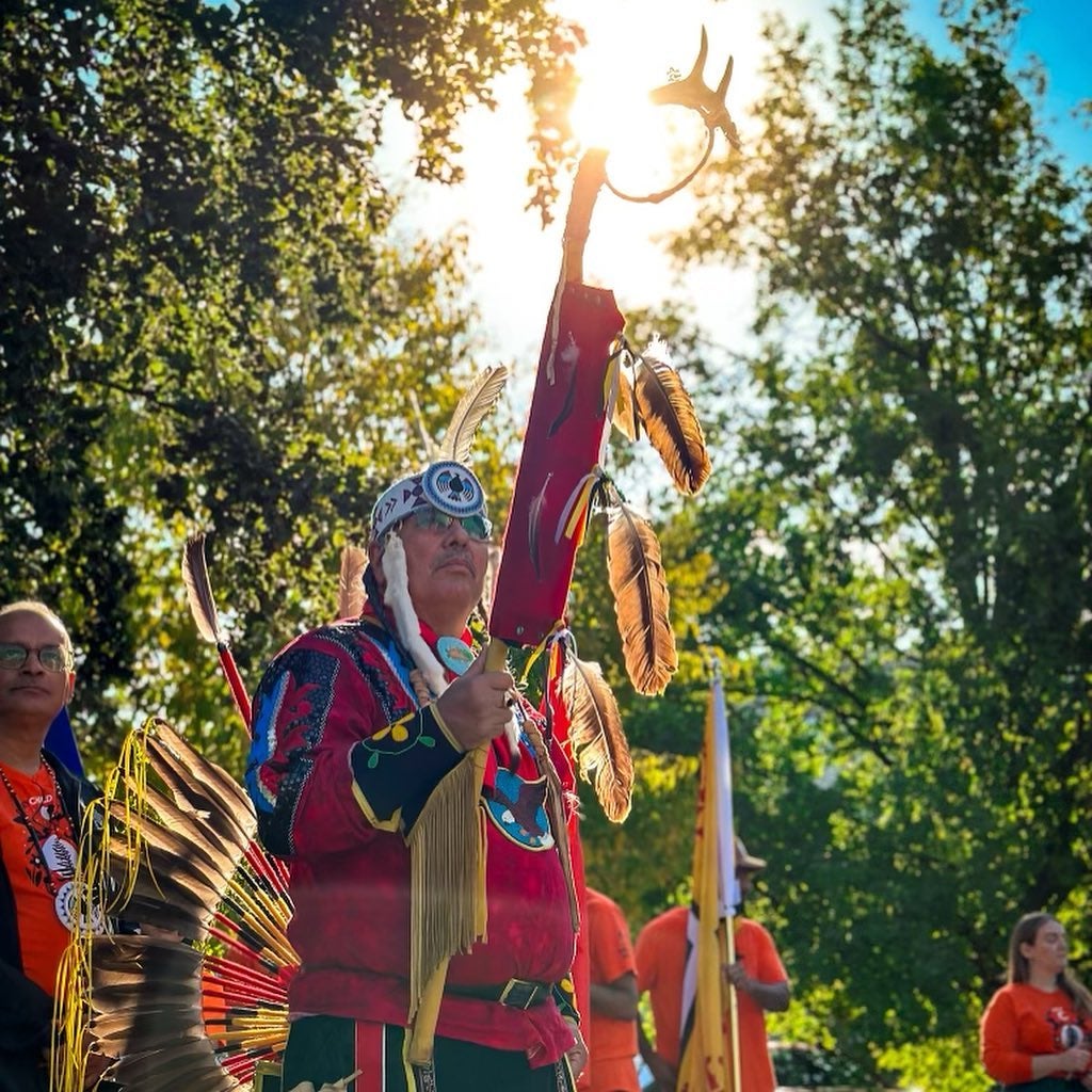 Elder Myeengun Henry holding the Eagle Staff during the Sunrise ceremony