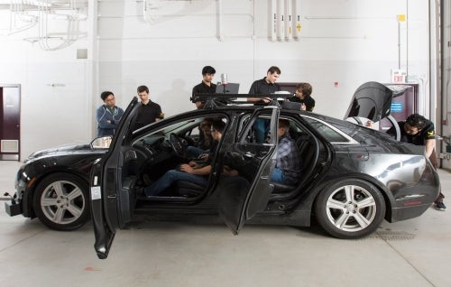 students working on autonomoose car