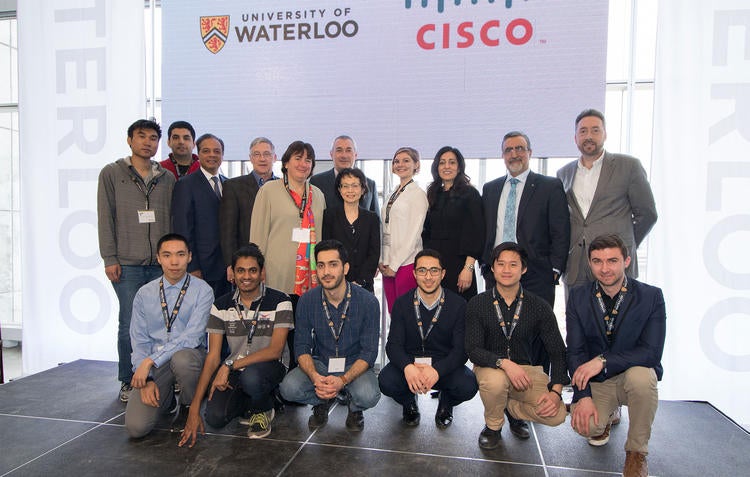 Cisco participants smile at the camera.