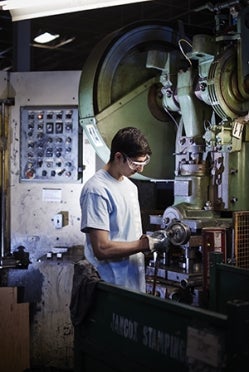 Student working with machinery