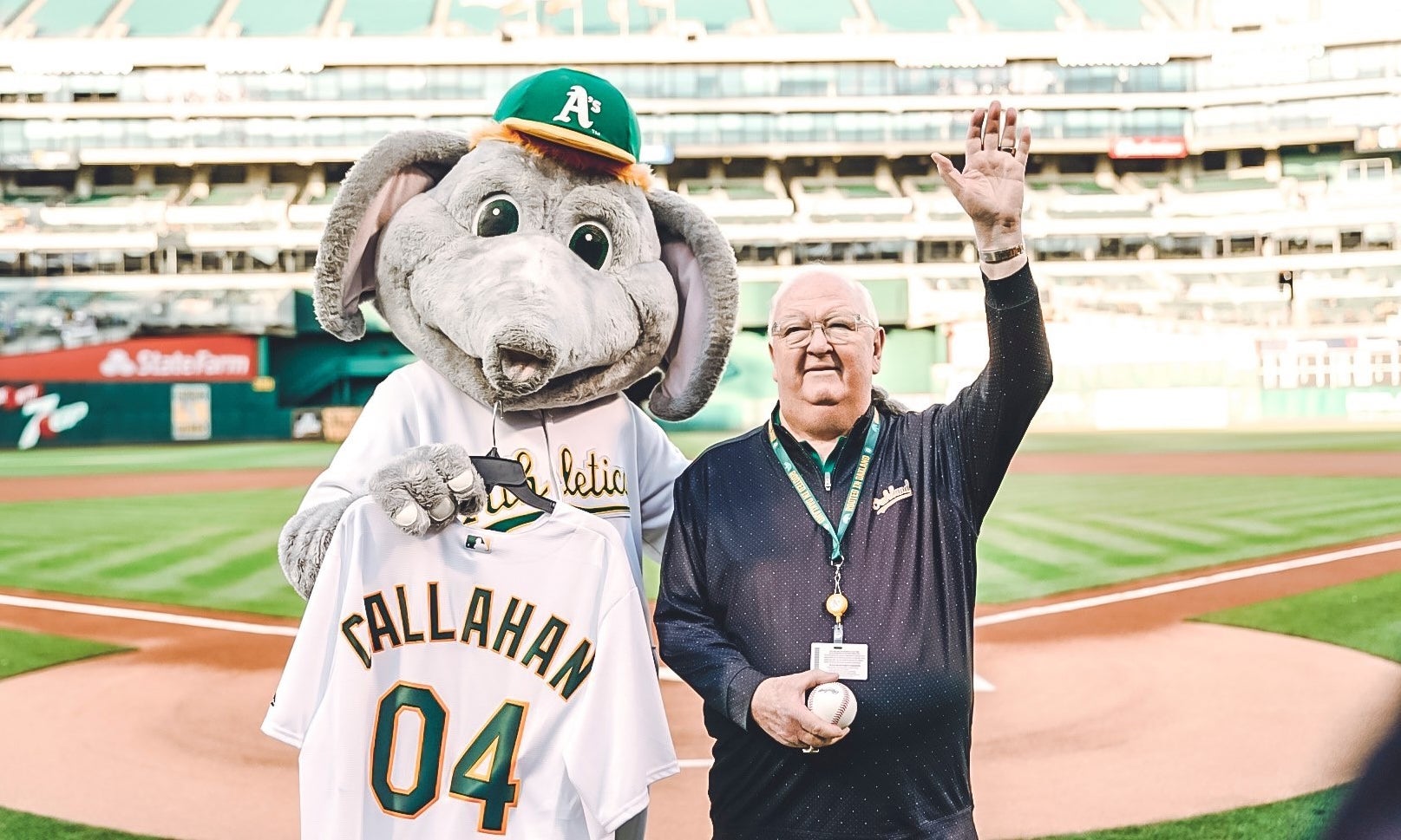 Oakland Athletics announcer Dick Callahan with A's mascot, Stomper the elephant.