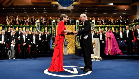 Physics laureate Donna Strickland receives the prize from King Carl Gustaf of Sweden during the Nobel Prize award ceremony.