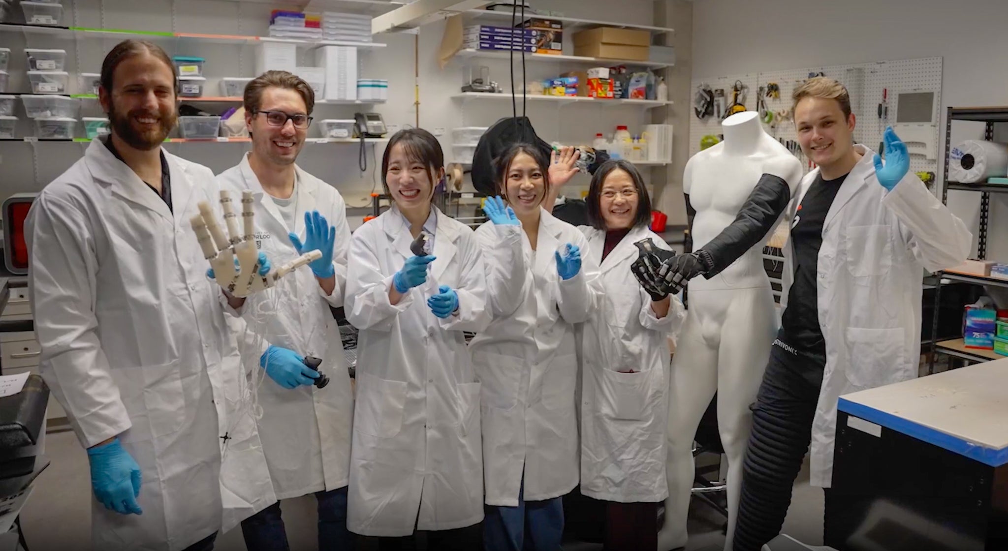 Dr. Carolyn Ren with graduates students inside the Waterloo Microfluidics Laboratory