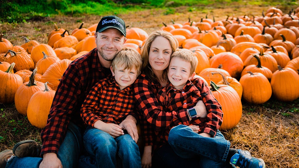 Meghan and John Snyder with their kids at the Snyder's Farm pumpkin patch