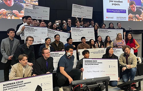 Winning teams on stage with large cheques at 2024 Esch competition