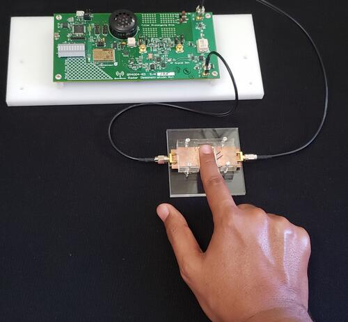 Researchers test a prototype of a new diabetes device for prick-free glucose monitoring.