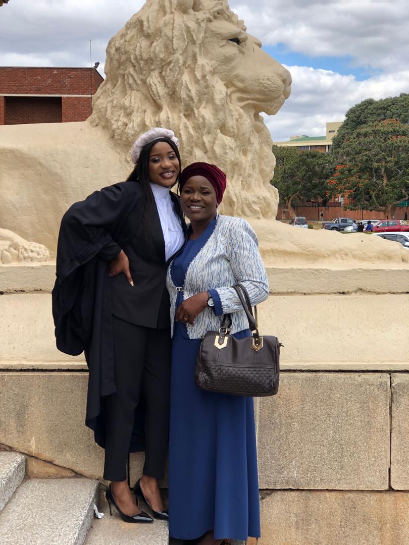 Ida stands with her oldest daughter at the Supreme Court ground in Zambia