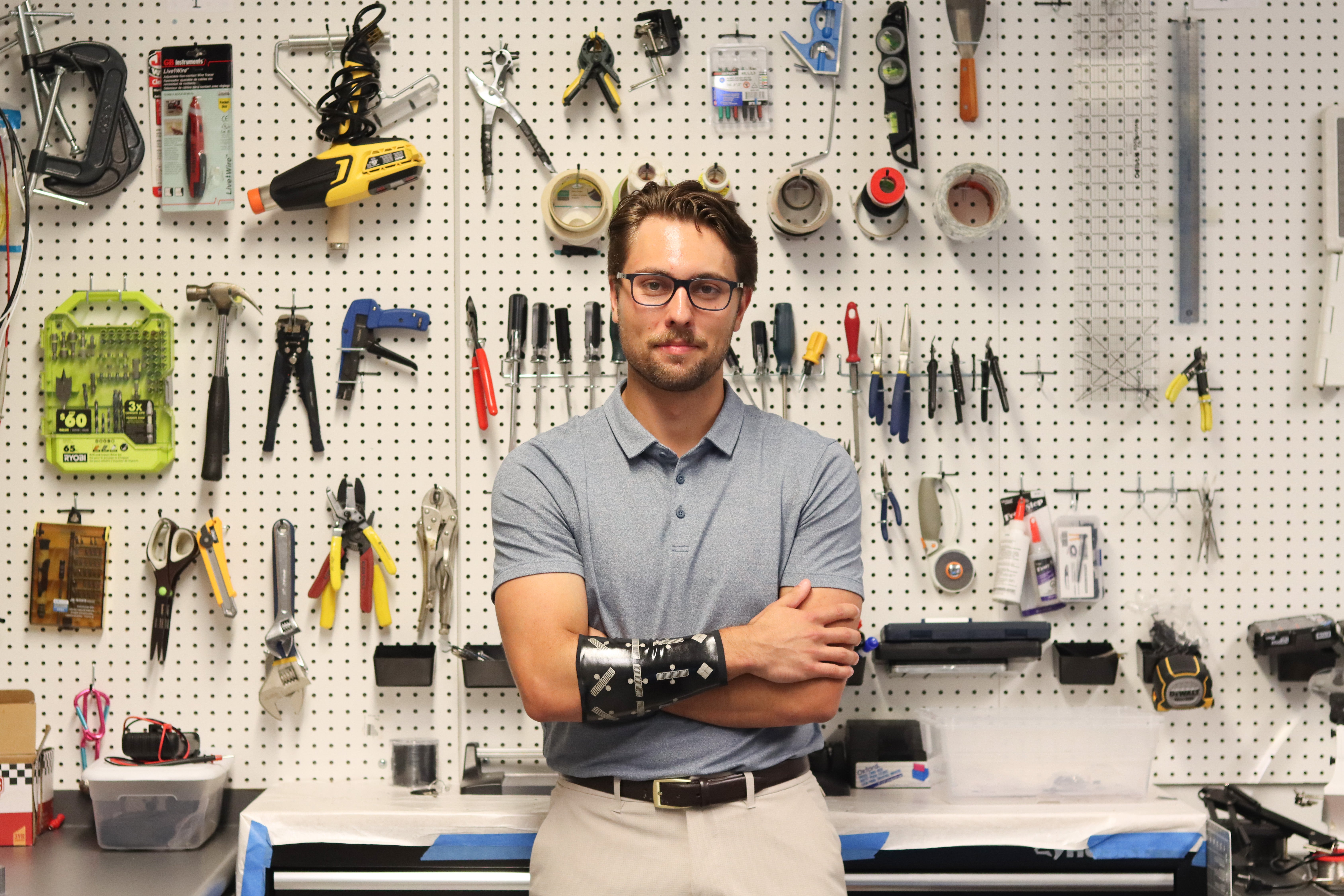 Nicholas Levinski wearing a prototype of the sleeve in the lab