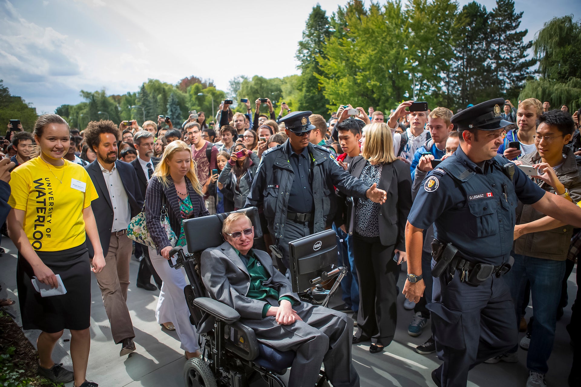 Stephen Hawking being greeted by crowds in 2012.