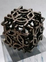 A small, islamic charm 3D printed in metal by Craig Kaplan