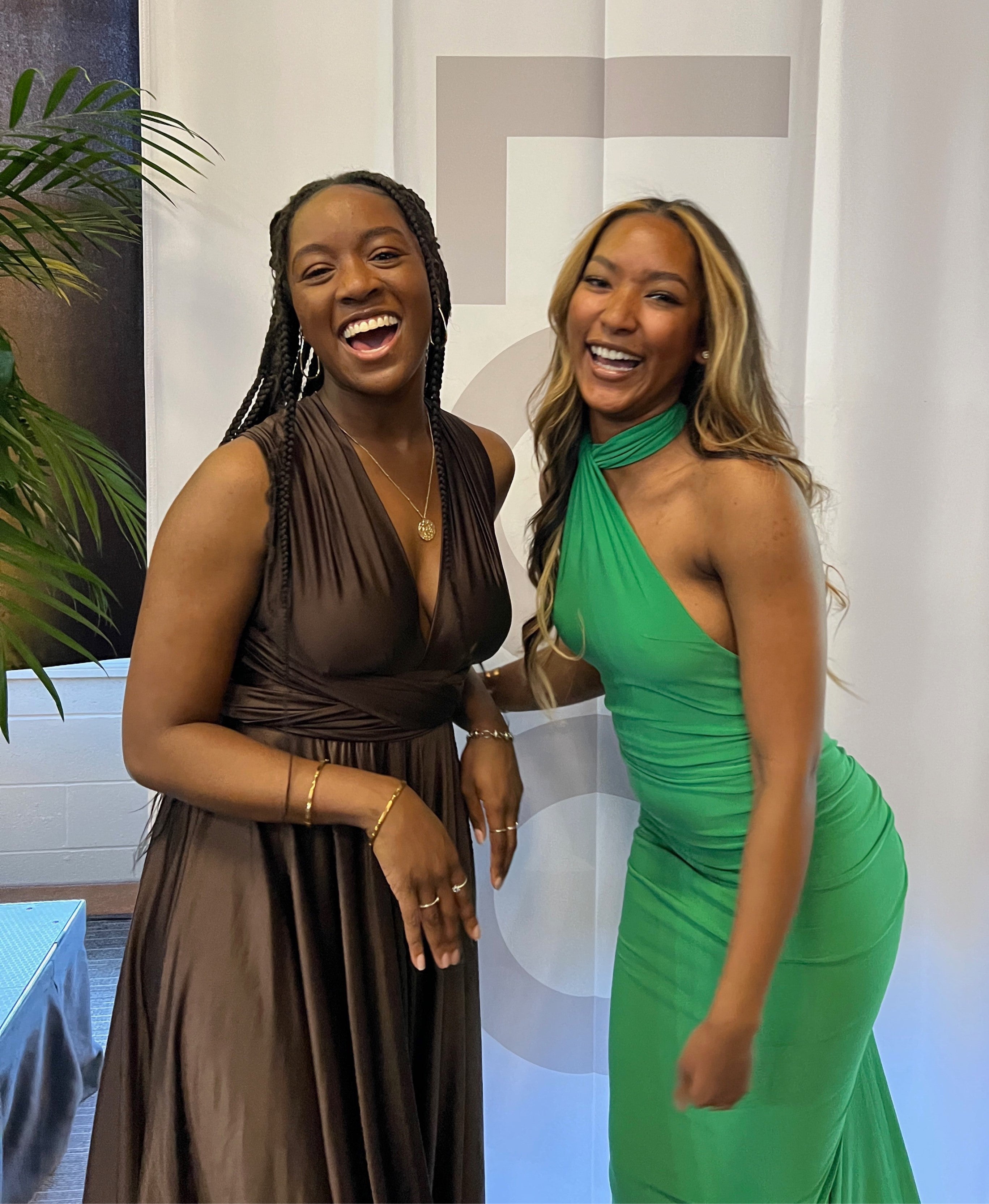 Marianna Sukhu laughs at a formal event with a friend.
