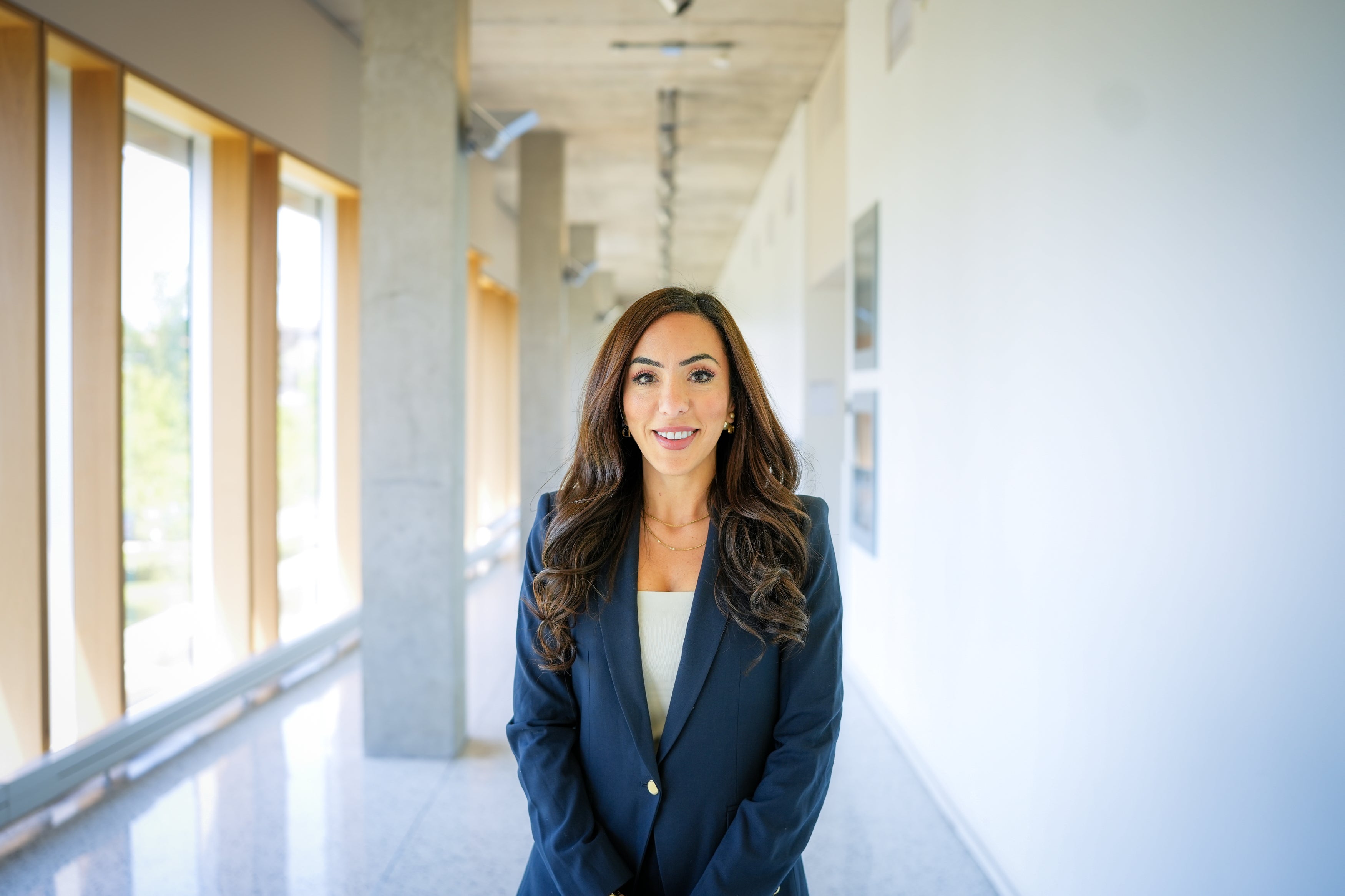 Smiling woman standing in hallway