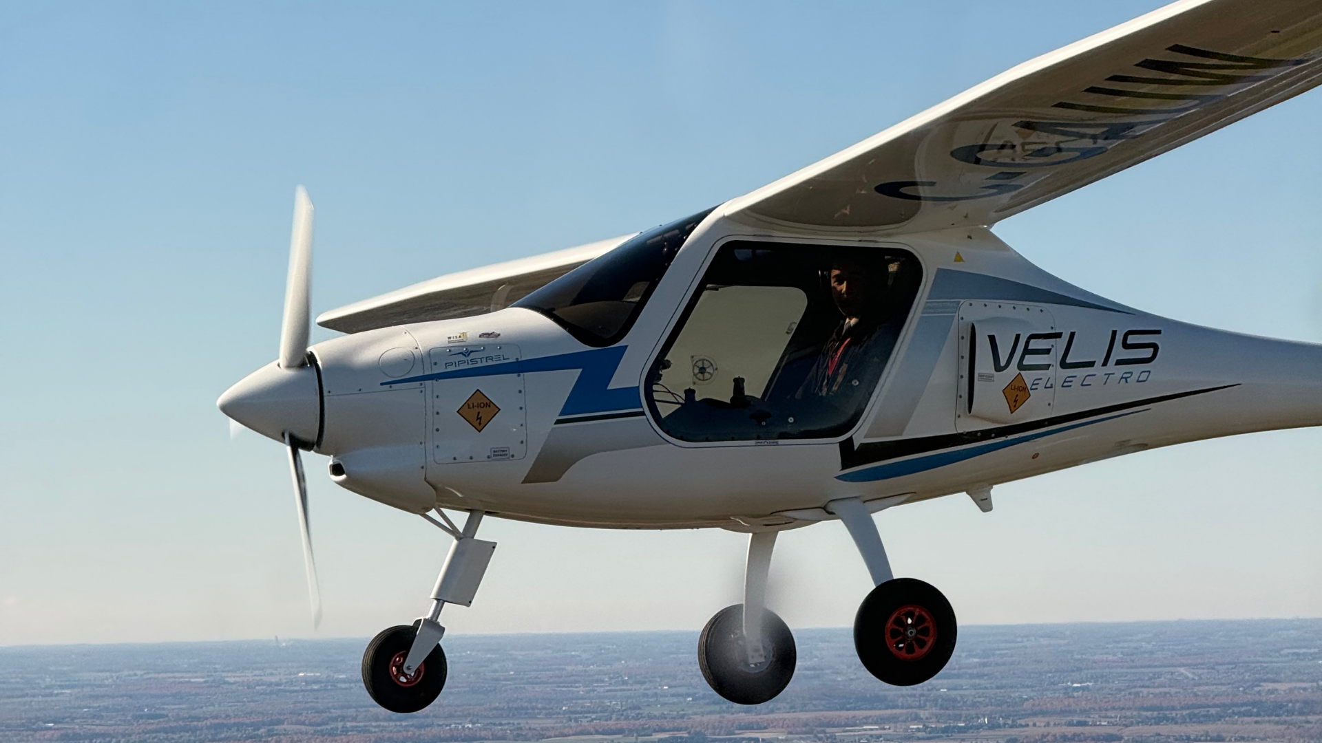 The Velis Electro plane in the air.