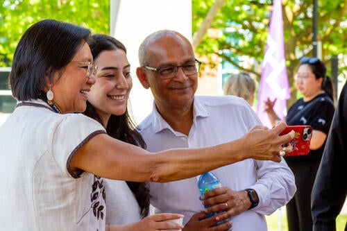 Vivek poses for a selfie with attendees