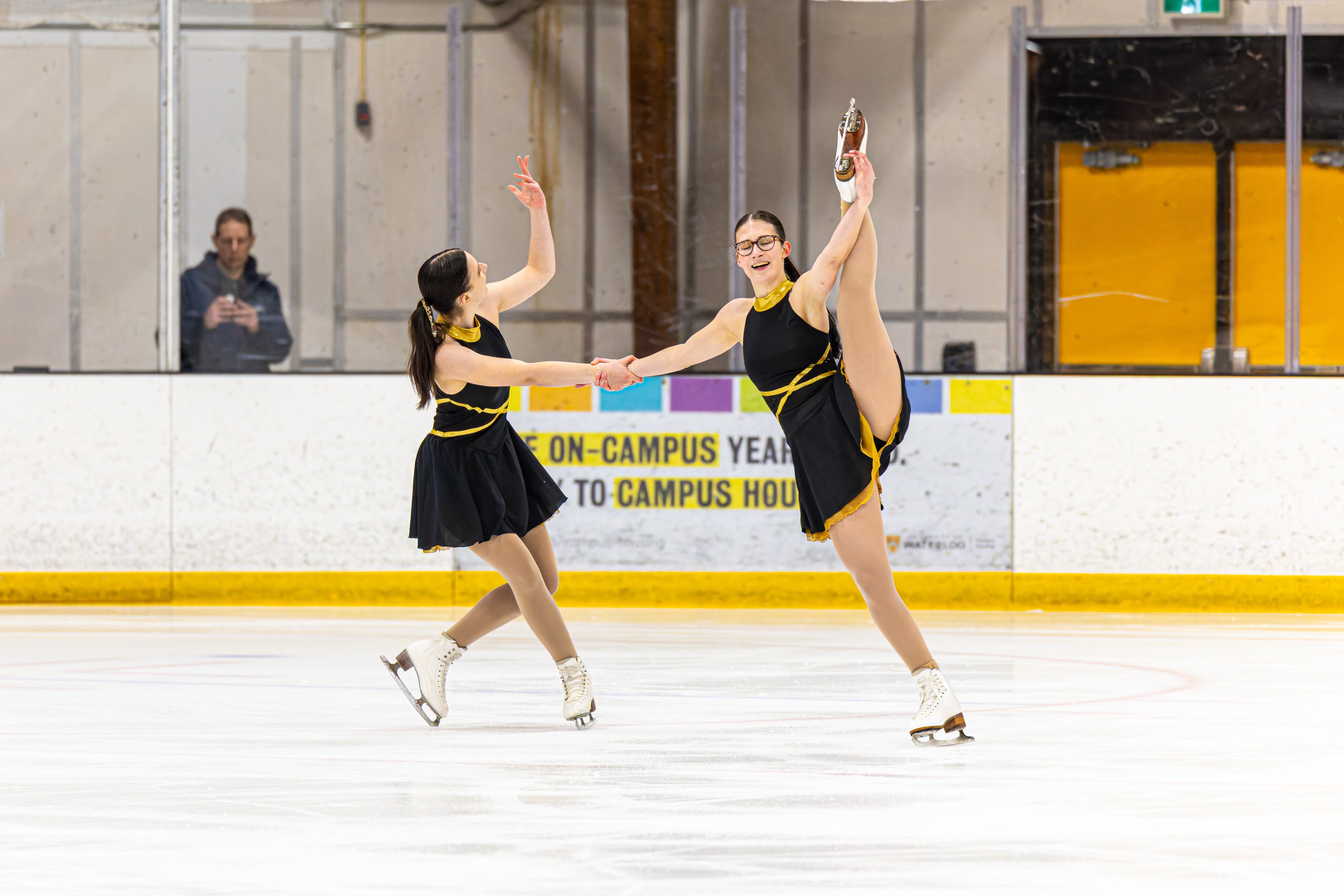 Two skaters on the ice. 