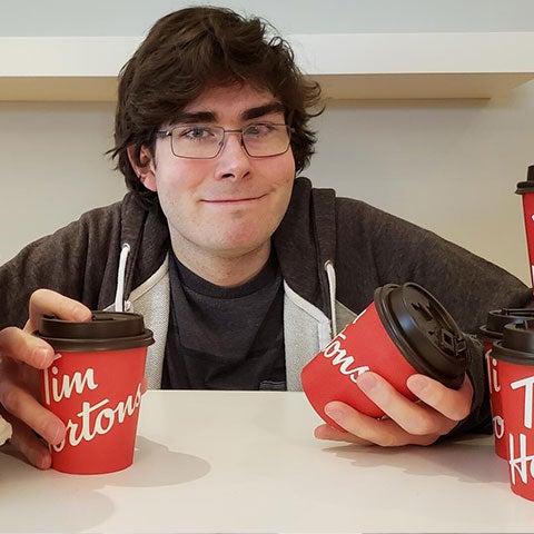 Professor with tim hortons cups