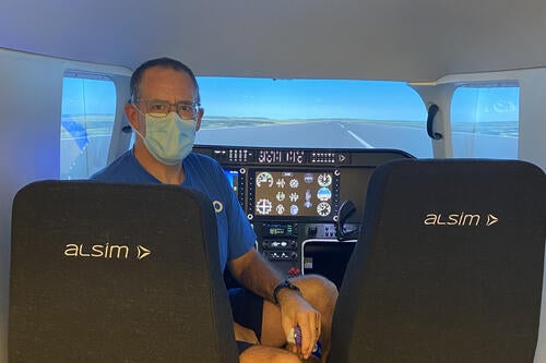 Dean of Science Bob Lemieux in the flight simulator