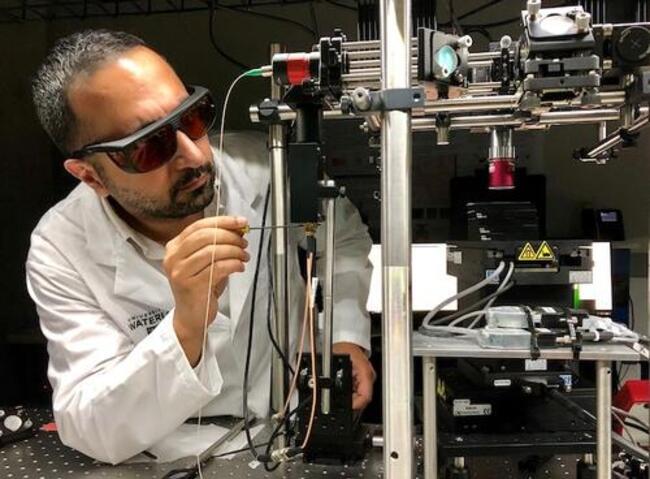 Parsin Haji Reza works in his lab.