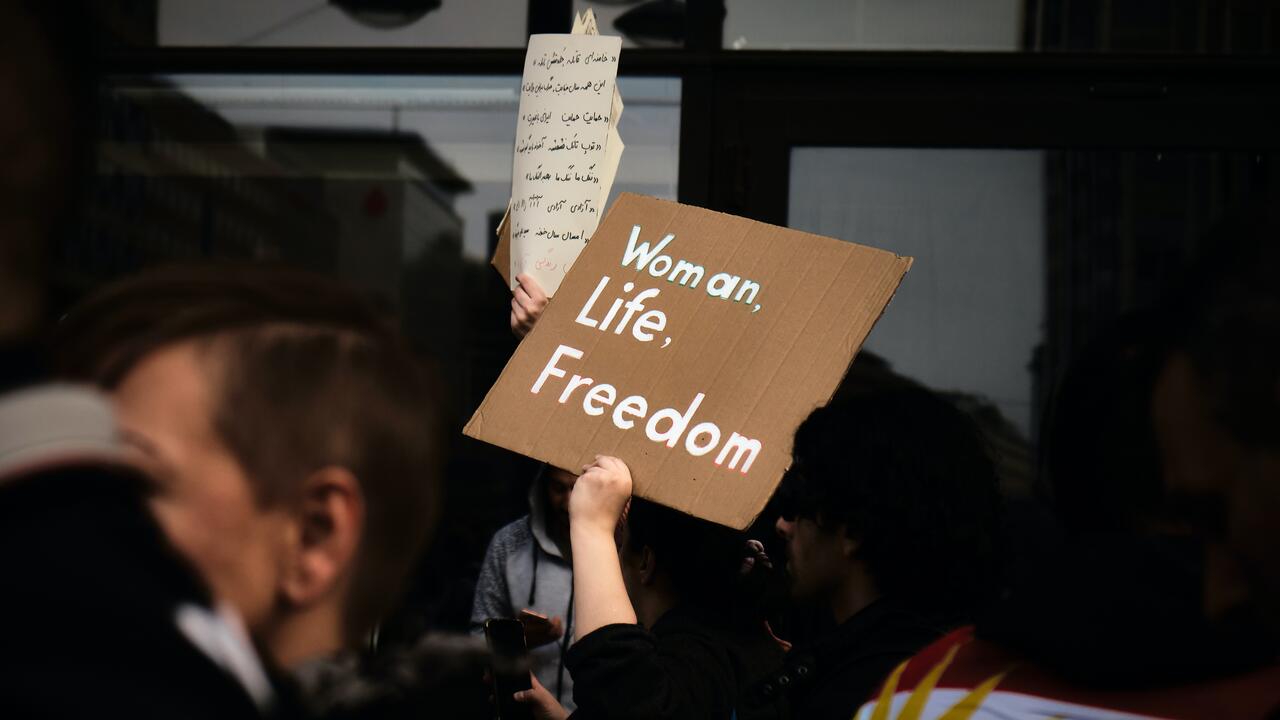 Protest sign that reads, &quot;Woman. Life. Freedom.&quot;