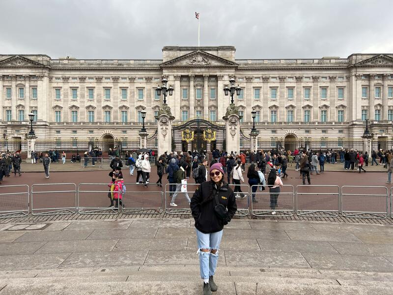Tharindya Abeyratne stands in front of Windsor Castle in London, England