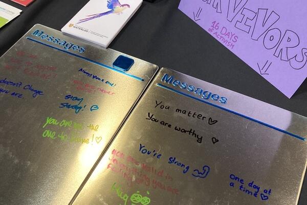 Messages written on a board that support survivors of gender-based violence