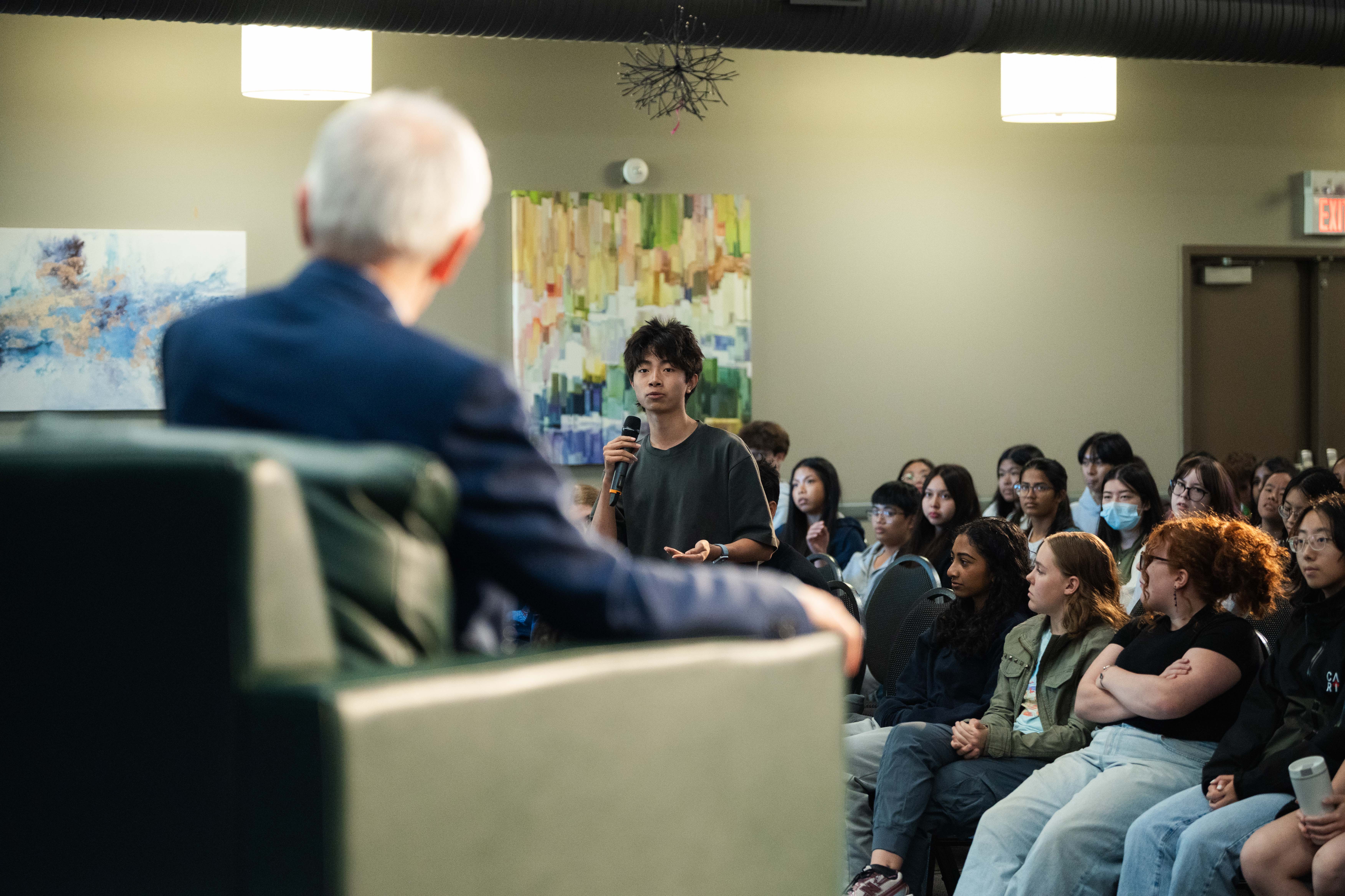Dr. Andrew Steer speaking with high school students during the Q&A.