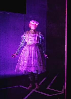 Actor as little girl in dress wearing VR headset