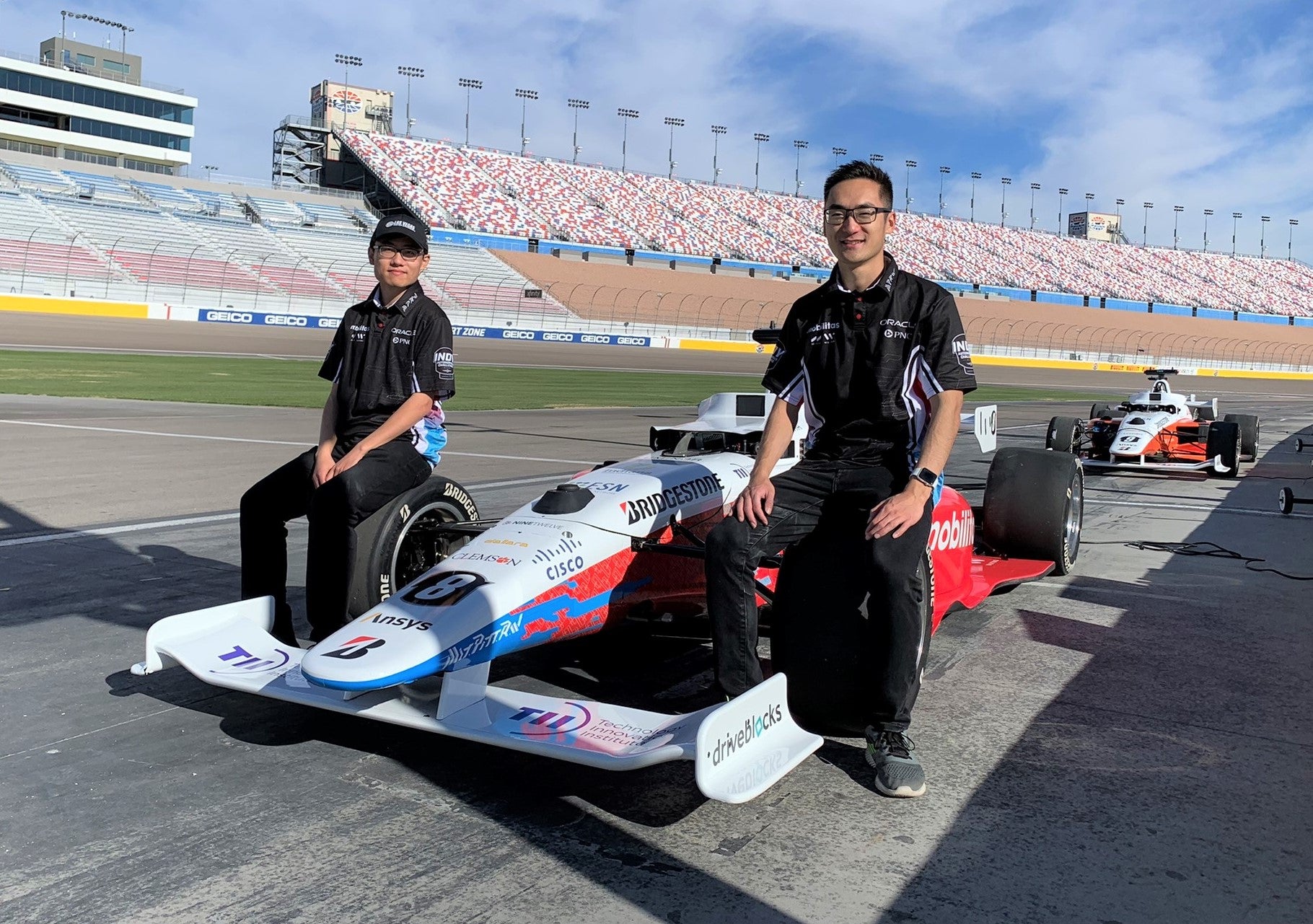 Ben Zhang and Brian Mao with their car in Las Vegas.