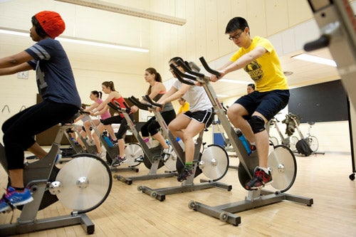 David Huang participating in a spin class