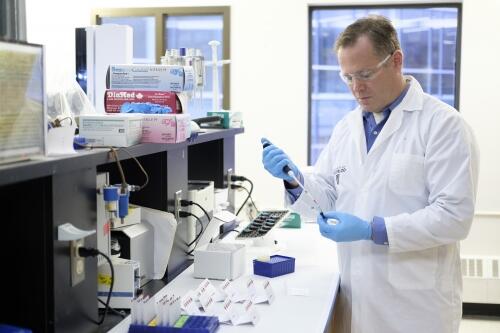 Professor Ken Stark testing samples in a lab