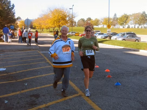 David Johnston runs in a hockey jersey