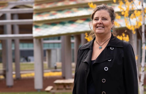 Dale Bellaire stands in front of Indigenous Outdoor Gathering Space
