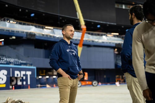 Jeremy Reesor chats with colleague on the field at Rogers Centre