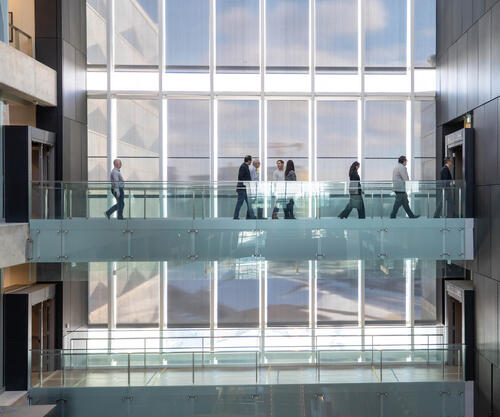 OceanMD delegation cross the fifth level walkway within the Pearl Sullivan Building
