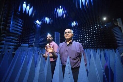 Research associate Aidin Taeb, left, and professor Safieddin Safavi-Naeini stand inside the anechoic chamber in the Engineering 5 building at the University of Waterloo.