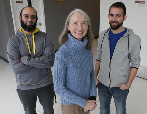 Professor Catherine Gebotys (center) poses with PhD student Karim Amin (left) and research associate Mustafa Faraj (right) from her research group working on improving security for the Internet of Things
