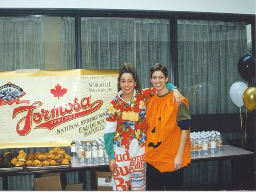 Costumed participants stand in front of the post-race snacks