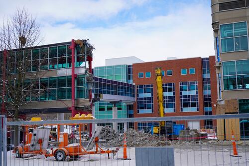 Construction crews demolish the DC-MC bridge