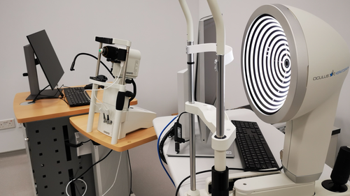 A machine lit up with concentric black and white circles to measure dry eye disease