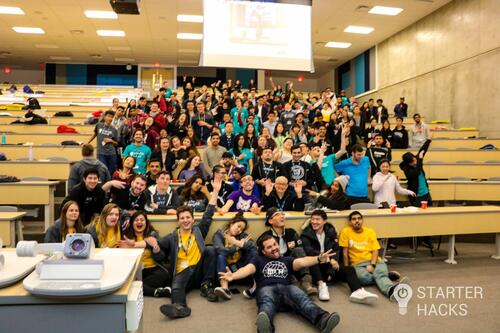 Large group of students posing for silly photo at Starter Hacks