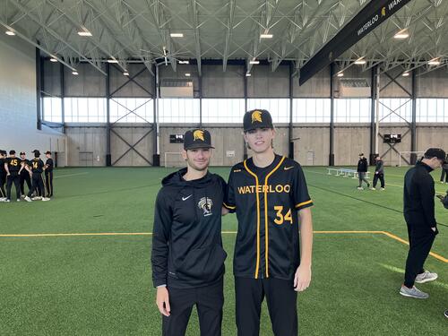 Jesse Levine poses inside the Field House with Ryan McNeill